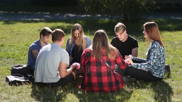 depositphotos_156919188-stock-video-young-christians-sitting-in-circle